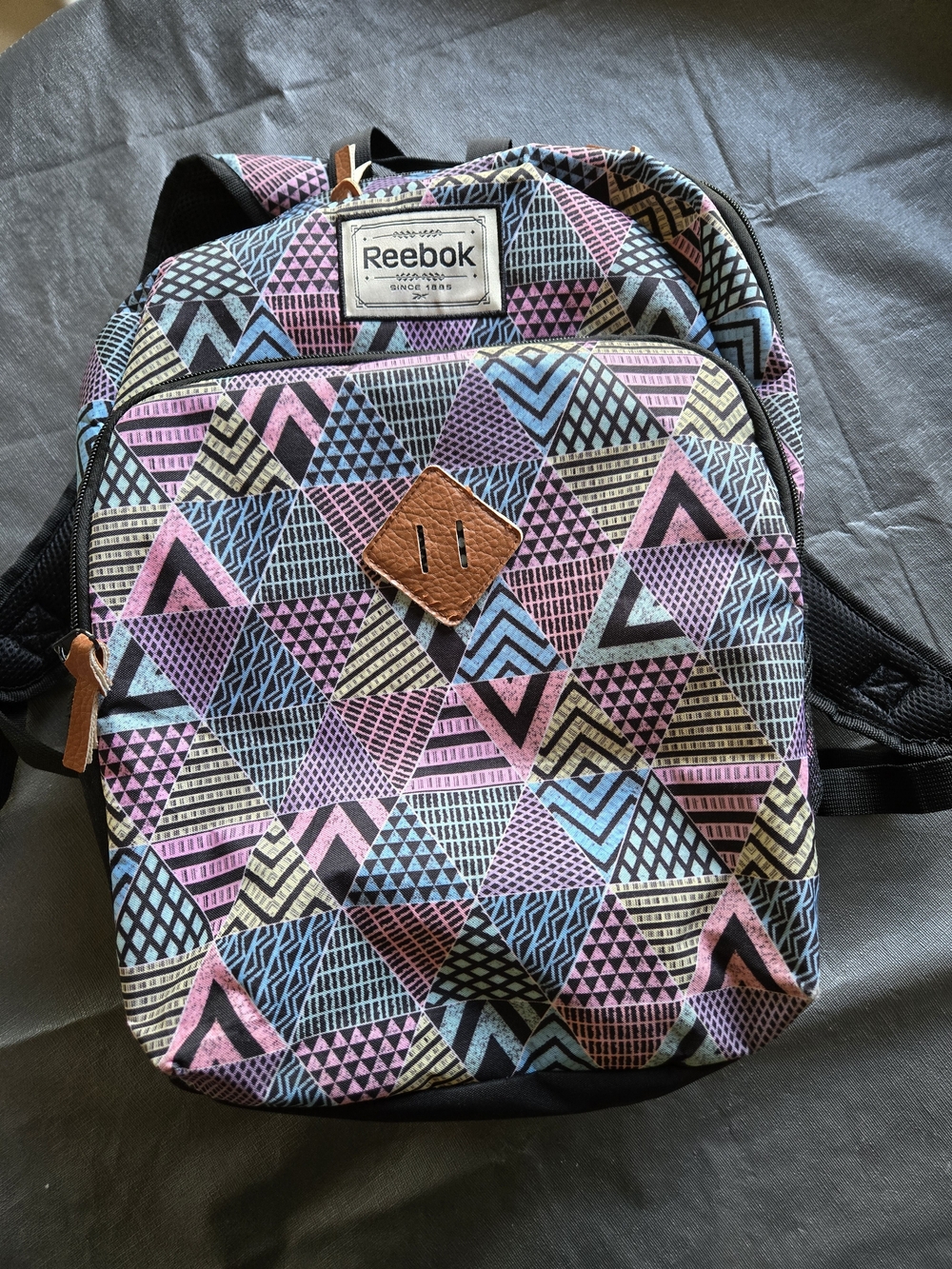 Reebok Pastel Geometric Triangle Print Backpack With Laptop Pocket